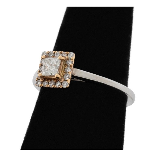 14K White Gold and Yellow Gold Diamond Ring, featuring one centered yellow gold prong set princess cut diamond weighing...