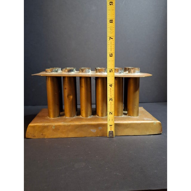 Offered for sale is an extremely rare, museum-grade antique 12-tube solid brass candle mold, dating from the late 18th to...