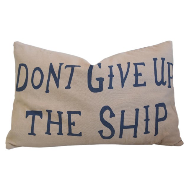Custom-tailored nautical coastal-themed pillow in a printed cotton canvas fabric depicting the wording "Don't Give Up The...