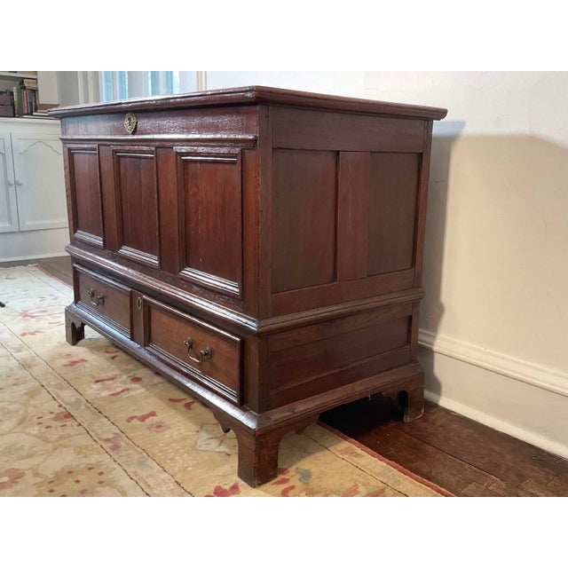 An 18th Century rectangular oak George III blanket or mule chest with traditional joinery, a lift-top upper section with...