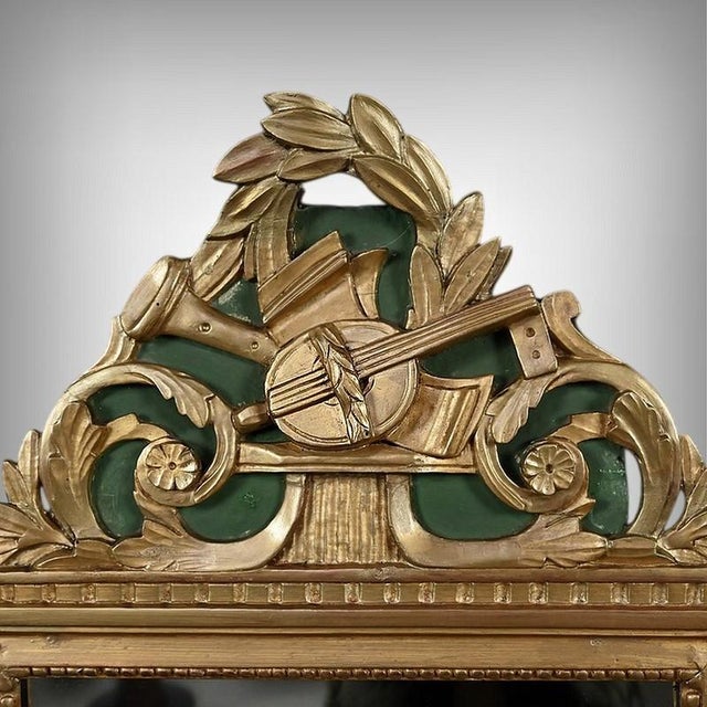 This Louis XVI style mirror captivates with the elegance of its sculpted frame and the richness of its ornamentation. Its...
