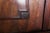 Solid mahogany veneered body. Cast fittings. Upper two-door section with shelves and internal drawers and lower drawer...