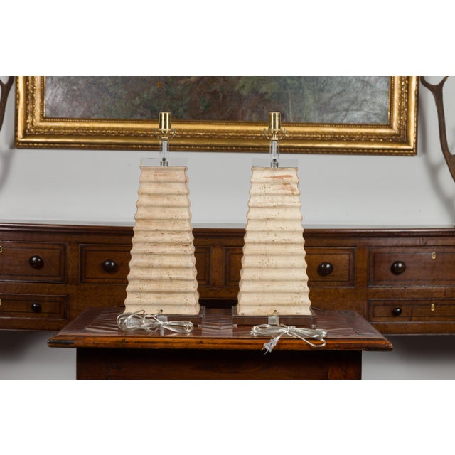 A pair of Italian vintage wooden fragment pyramid-shaped table lamps from the mid-20th century, with Lucite accents. We...