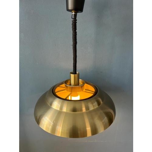 Flying saucer space age pendant by Dijkstra. The shade has a shiny copper coloured surface that creates a nice reflection....