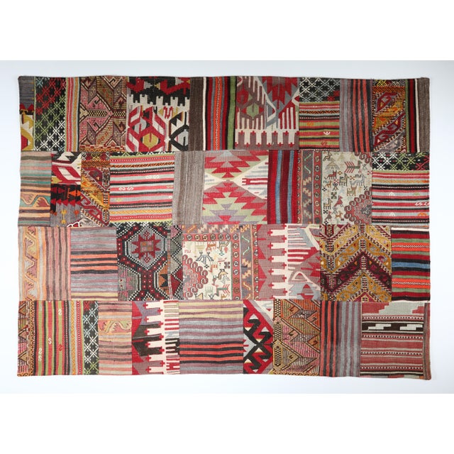 Handmade Anatolian Kilim Patchwork Rug Using Vintage Wool Kilims -5' 9'' X 8' This striking patchwork kilim is handcrafted...