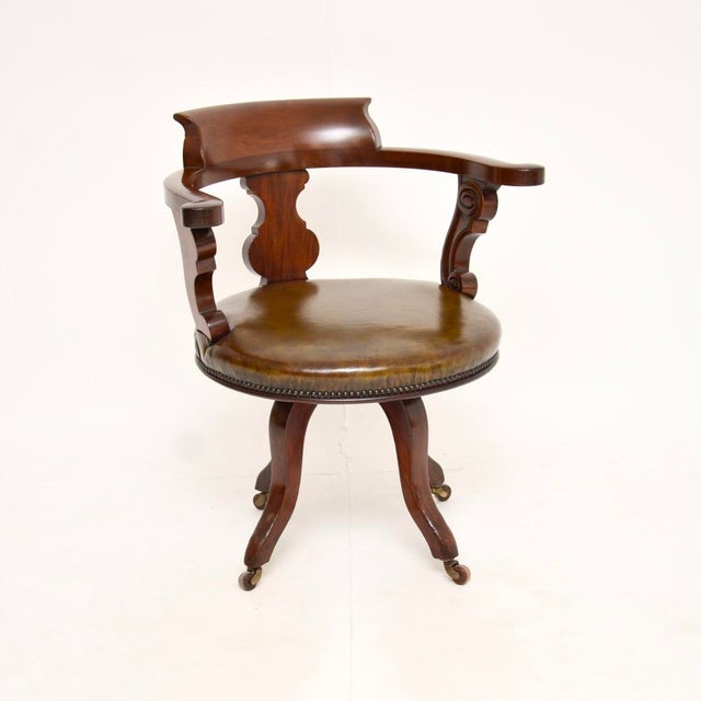 A smart and very well made antique Victorian swivel desk chair. This was made in England, it dates from around the 1860-80...