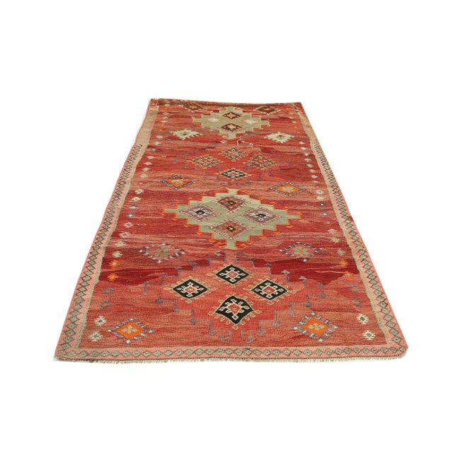 Decorative handwoven vintage kilim rug from Kars region of Turkey. Approximately 50-60 years old. In very good condition.
