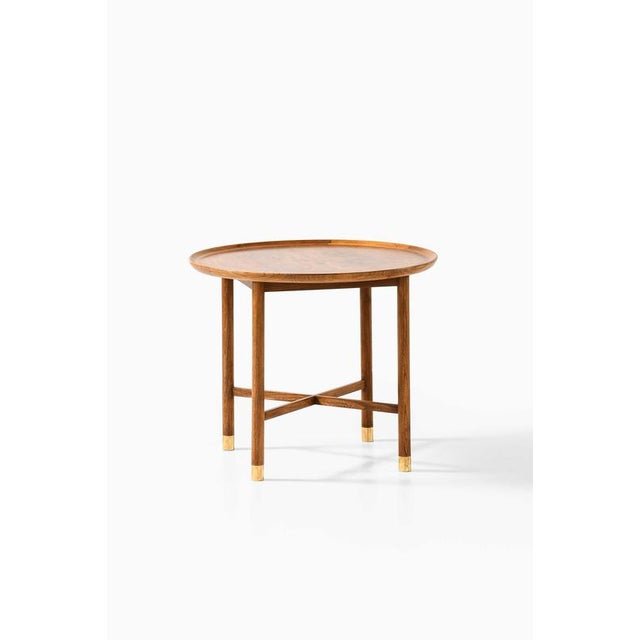 This very rare coffee table, attributed to mogens lassen and presumably crafted by danish cabinetmaker k. Thomsen in the...