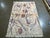Hand-knotted Nepal wool rug featuring an ivory field with an allover abstract floral design. The composition includes...