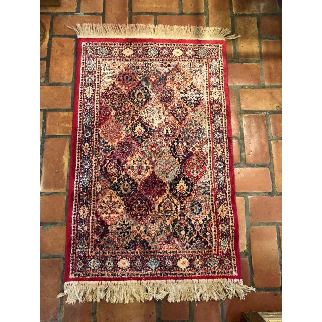 Silk Persian prayer mat. Deep rich magenta tones with creams and blues. Hand knotted and adorned with fringe. Please...