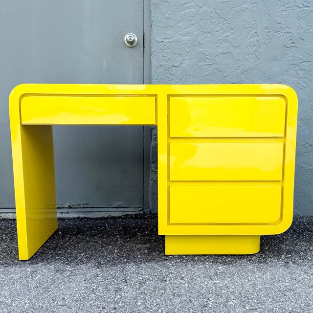 This striking Postmodern waterfall desk makes a bold statement with its vibrant high-gloss yellow laminate finish and...