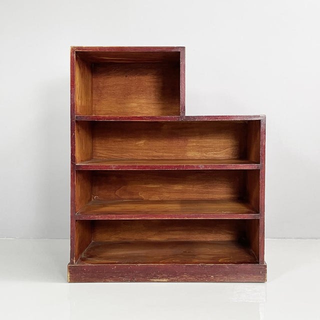 Italian Art Deco rectangular bookcase in red wood, 1940s Rectangular bookcase entirely in red wood. It has four...