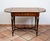 Napoleon III-style coffee table/writing desk in polychrome woods with gilded bronze accents, dating from the second half...