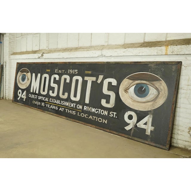 Reclaimed movie set sign made of aluminum in black, white, blue, brown, and yellow colors. The sign reads "Est. 1915,...