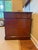 Antique three piece pedestal desk featuring a red embossed leather top with three drawers. Double pedestal bases are on...