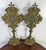 19th century pair of ornate gilded relicquaries made of brass with a gilt finish. The feature highly decorative Baroque or...