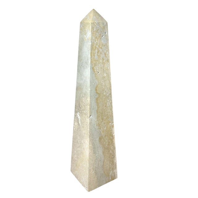 A vintage polished travertine obelisk, was used by a very famous decorator in the 1970s.