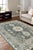 Rhea Traditional Green Hand Knotted Wool Rug, Country of Origin: India. This exquisite piece offers a sophisticated take...