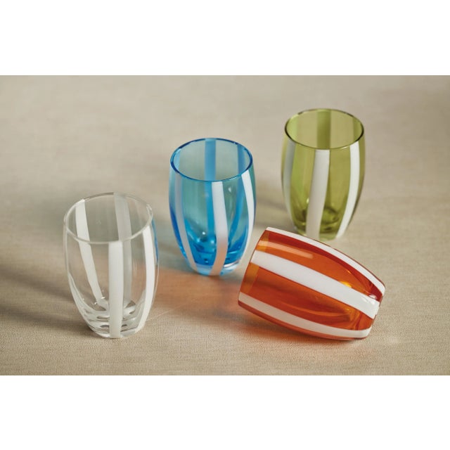 This lovely stemless glass is a stunning work of art. The shape is a classic tapered cylindrical shape, but the design of...