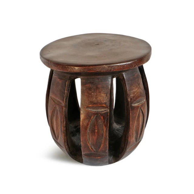 Vintage Baga Nimba round carved wood small stool. Impressive craftsmanship with elegant modern curved wood slatted base....