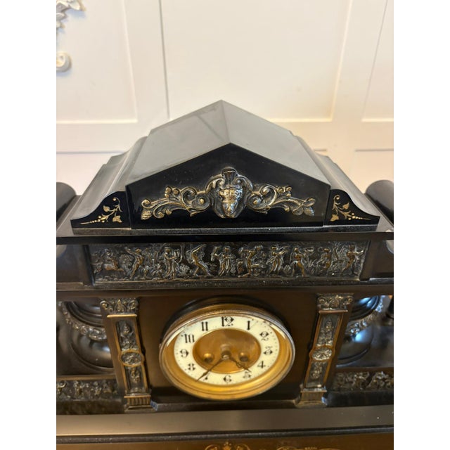 An exceptional large Victorian marble mantel clock of impressive scale and presence crafted in richly figured marble with...