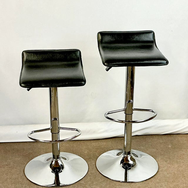 A fabulous pair of sleek contemporary modern Italian style barstools. They can be used at counter height or bar height...