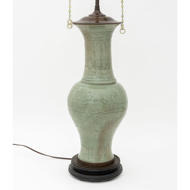 Chinese Longquan Celadon Yen-Yen Vase Mounted as a Table Lamp, the vessel 17th century and carved with floral motifs, the...