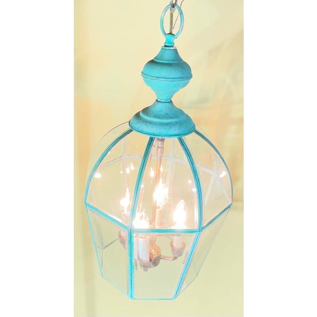 Elegant Vintage Solid Brass Hanging Lantern Chandelier. Featuring a classic hexagonal frame that beautifully transitions...