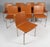 Jørgen Høj set of eight dining chairs in stainless steel. Seat and back upholstered with tan leather. Made by PP møbler....