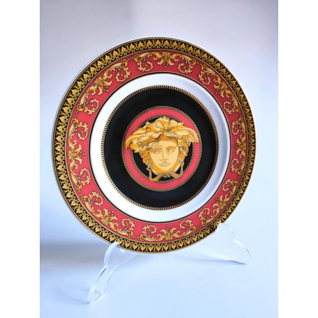 Stunning Versace plate in Rosenthal porcelain, with iconic jellyfish pattern, in red colours and gold plated, from a...