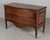 An 18th century Italian Louis XV period walnut commode with elegant serpentine front. Made of solid walnut with fine hand-...