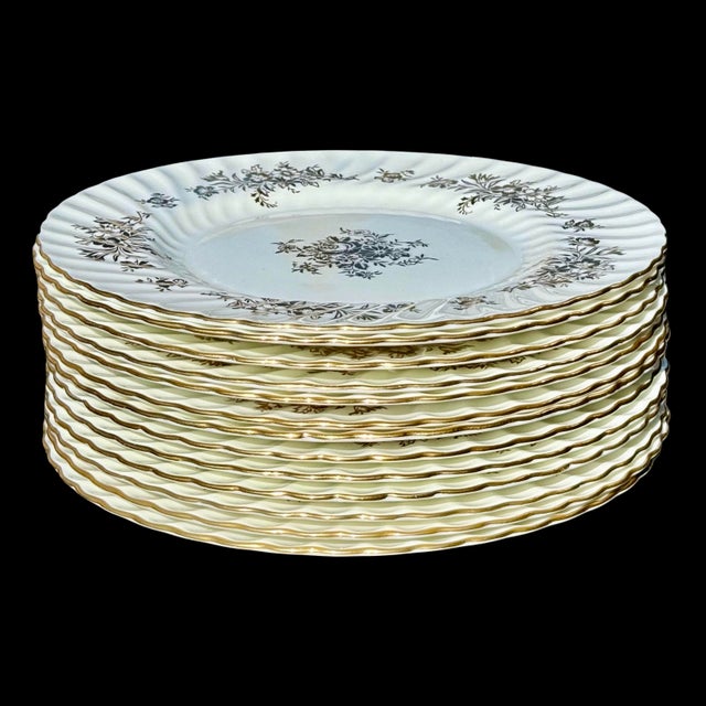 This set of thirteen vintage plates is produced by Minton, one of England’s most respected porcelain manufacturers,...