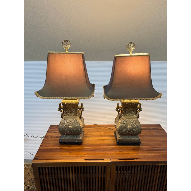 Design Plus Gallery presents a Pair of Chinoiserie Table Lamps are in the Style of James Mont. The unmarked lamps are...