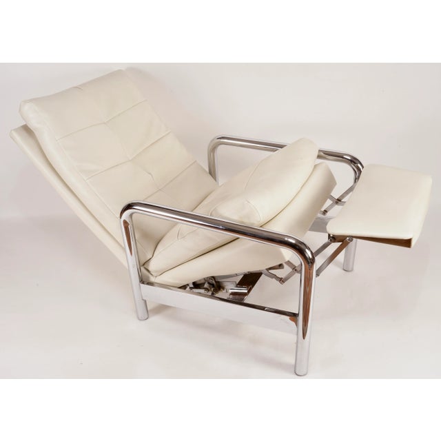 This is a chic recliner by Milo Baughman for Thayer Coggin. It has tubular chrome legs and thick, comfortable cushions....