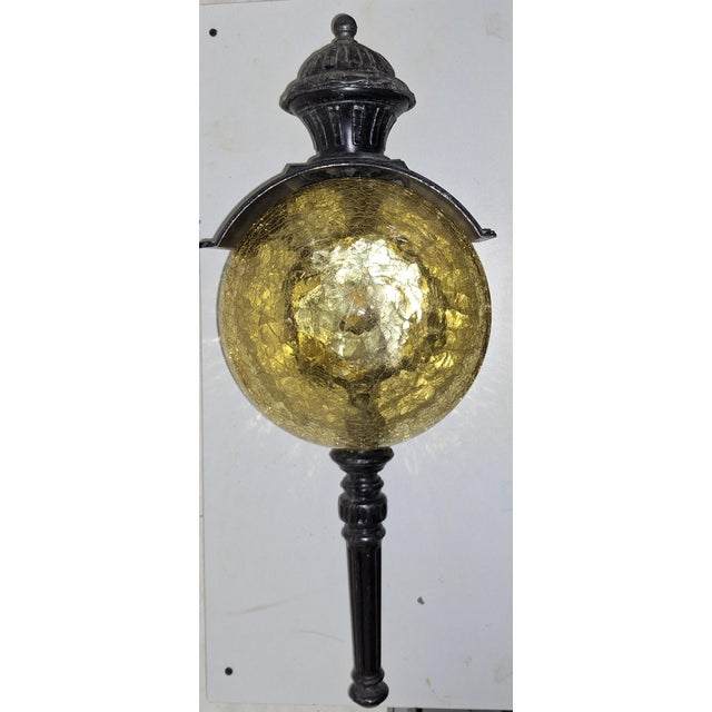 Vintage Rustic Wall Lamp with Black Patinated Metal Frame and Amber-Colored Glass Shade, 1970s, in Very Good conditions....