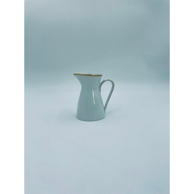 A milk jug from the renowned Rosenthal manufacturer, from the Form 2000 line, crafted from high-quality white porcelain....