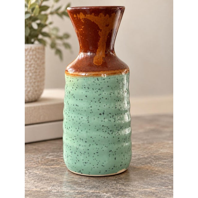 Beautiful vintage ceramic pottery vase featuring a stunning combination of soft aqua green and rich rust brown glazes....