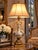 This table lamp features a baluster-form blown glass body with reverse-painted églomisé decoration depicting classical...