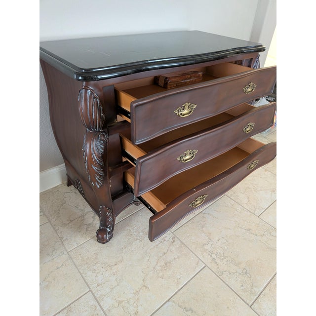 Add classic European elegance to your home with this striking vintage 1980s Bombay (bombé) chest. Originally retailed by...