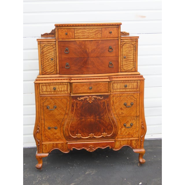 This classic Chest of Drawers is made out of wood, solid wood, walnut, and tiger veneer. This Chest of Drawers proudly...