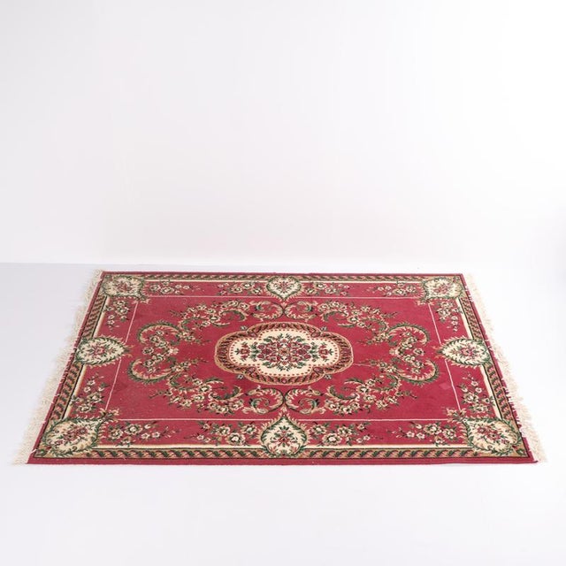 Genuine rug, hand-knotted and richly patterned in warm reddish tones. Traditional craftsmanship with fine detailing and...