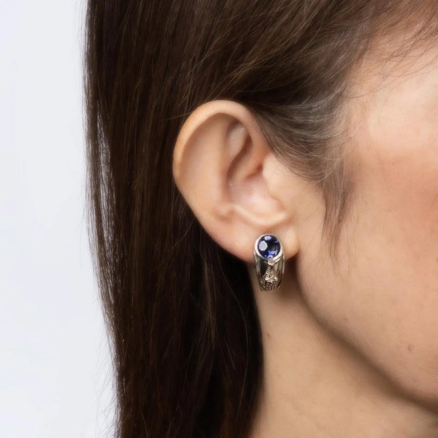 Finely detailed pair of vintage Kieselstein Cord Alligator earrings crafted in sterling silver (circa 1999). Iolite...