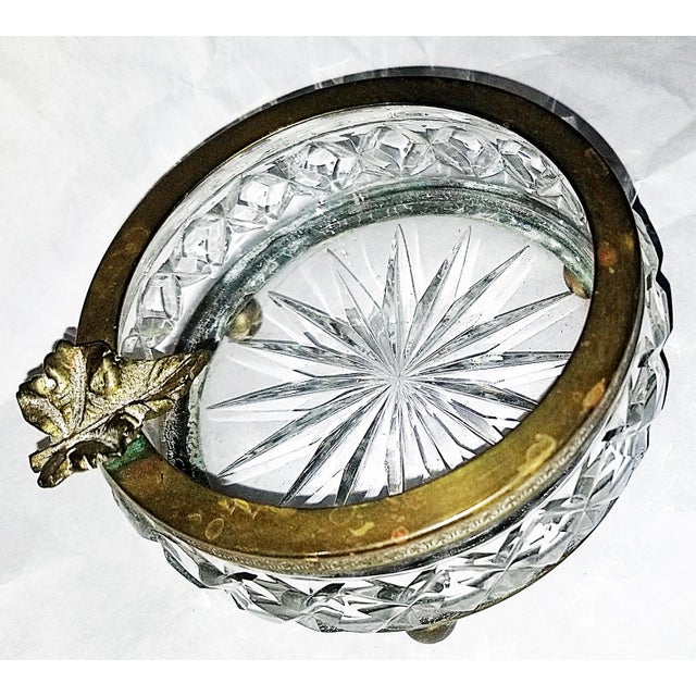 What a fun catchall, this 1920s French crystal and gilded bronze ashtray with mapleleaf holder on the tooled leaf pattern...