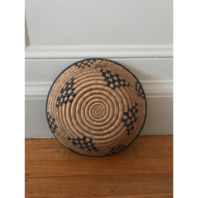 Beautiful round hand-made African woven basket blue and brown. Decorative and functional. Good condition. Acquired at an...