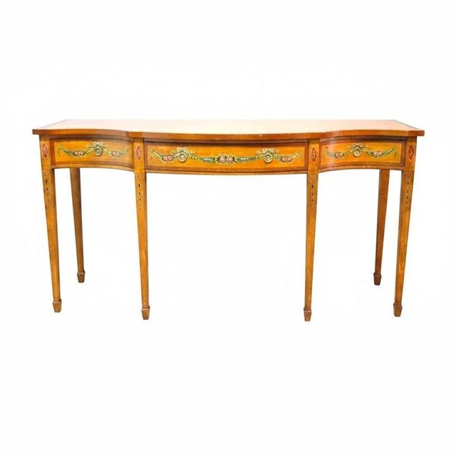 This Wellington Hall Reproduction sideboard dating to approximately 1930, embodies the refined aesthetics of the...