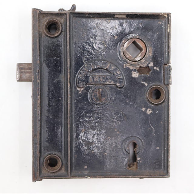 Antique right swing rim lock made of cast iron with a black finish. The original mounting screws are not available. Good...