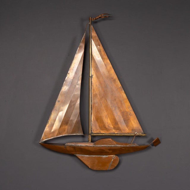 A 20th century handmade racing yacht, crafted in copper and designed for wall mounting. A wonderful decor piece for any...