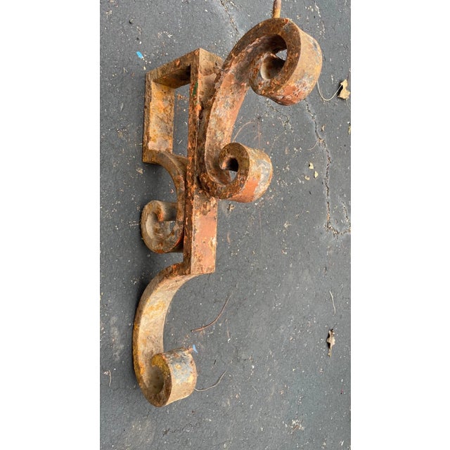 This large antique cast iron corbel bracket is a stunning piece of architectural salvage that would make a great addition...