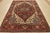 A traditional tribal Heriz rug hand-knotted with an all-wool pile on a cotton foundation. This oriental rug features a...