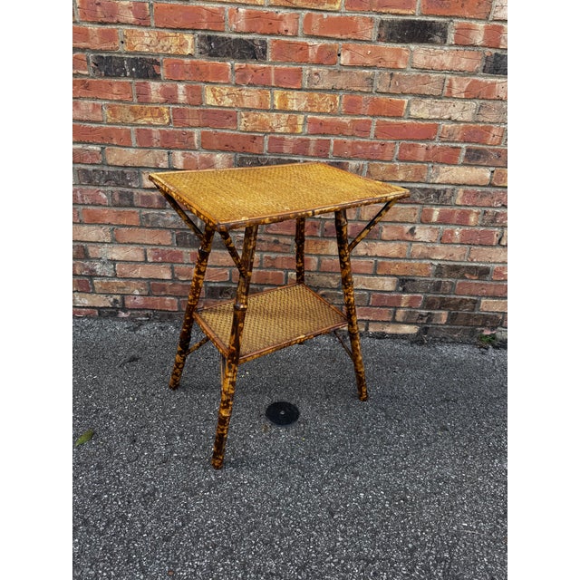 This is a beautiful 19th century English bamboo side table! Tables like these make excellent accent pieces because their...